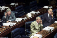 Senators work the phones during a plenary session of the Congress.