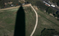 Shadow of the Washington Monument points to 17th and Constitution.