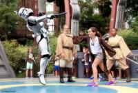 A young Padawan learner deals with a Stormtrooper.