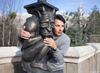 Actor Marcelo Serrado and Gargoyle outside the Beast's Enchanted Castle.