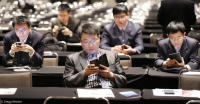 Chinese businessmen attend a trade conference in the U.S.