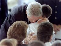 President Clinton hugs the son of a terrorist bombing victim.