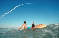 Kids watch near Cocoa Beach as John Glenn returns to space aboard Discovery.