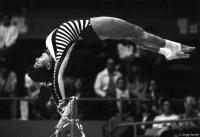 Oregon State University gymnast Tina Barnes loses her balance on the uneven bars.