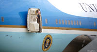 Steward opens the main door to presidential jet Air Force One.