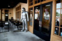 Humanoid robot Gort from 'The Day the Earth Stood Still' outside a restaurant.